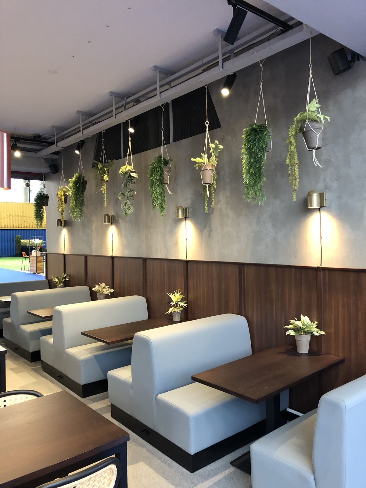 Theme Cafe Dining Space featuring Acoustic Brick Finish & Greenery Accents #22